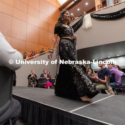 International students walk across the runway wearing cultural garments during the Global Glam fashion show at the Wick Alumni Center. The highlight of Global Glam included more than 80 students modeling traditional clothing from their country as well as clothing from student designers and local retailers. March 26, 2022. Photo by Jordan Opp for University Communication.