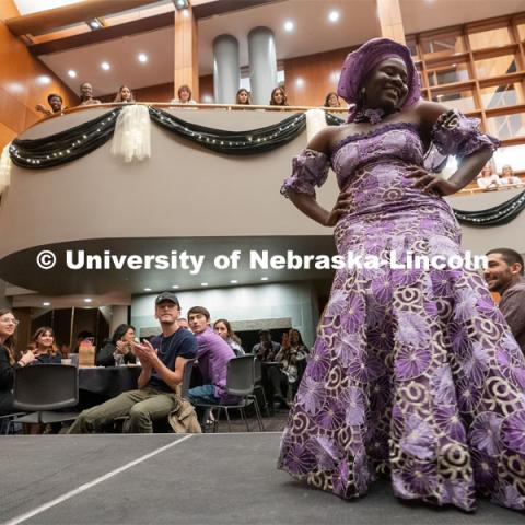 International students walk across the runway wearing cultural garments during the Global Glam fashion show at the Wick Alumni Center. The highlight of Global Glam included more than 80 students modeling traditional clothing from their country as well as clothing from student designers and local retailers. March 26, 2022. Photo by Jordan Opp for University Communication.