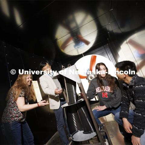 Wei Qiao demonstrates a wind turbine in the wind tunnel. College of Engineering photo shoot. March 30, 2022. Photo by Craig Chandler / University Communication.