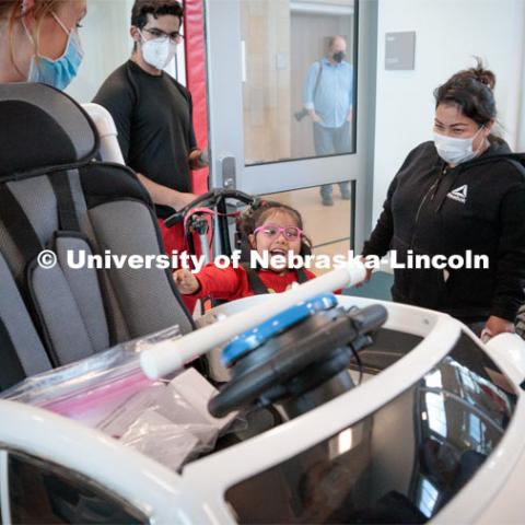 Four-year-old Dayana Torres gets a first look at the new, battery-powered car that UNL and UNMC students modified for her. 

Twice yearly, Nebraska’s Go Baby Go chapter modifies kid-sized battery powered cars for children with movement difficulties, providing them at no cost to the families. Nebraska’s GoBabyGo! chapter is funded by the Munroe-Meyer Guild. The program is a partnership between MMI's Department of Physical Therapy, the University of Nebraska-Lincoln and the University of Nebraska-Omaha Engineering Department and the UNMC College of Allied Health Professions/Physical Therapy students. The event took place on at the MMI building at 69th and Pine Streets in Omaha on Saturday, April 2, 2022. Photo by Kent Sievers / University of Nebraska Medicine.

