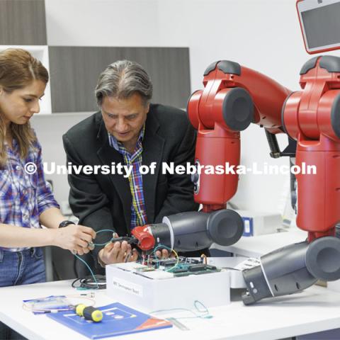 Kimia Ameri and Hamid Sherif work with a robotic arm in Hamid Sherif’s lab. College of Engineering photo shoot at Peter Kiewit Institute in Omaha. April 5, 2022. Photo by Craig Chandler / University Communication.