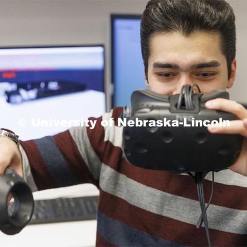 Pejman Ghasemzadeh works on a virtual reality project in Hamid Sherif’s Telecom lab. College of Engineering photo shoot at Peter Kiewit Institute in Omaha. April 5, 2022. Photo by Craig Chandler / University Communication.