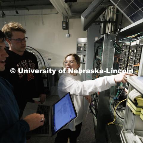 Students work out class assignments at the power panels in the PKI lighting lab. College of Engineering photo shoot at Peter Kiewit Institute in Omaha. April 5, 2022. Photo by Craig Chandler / University Communication.