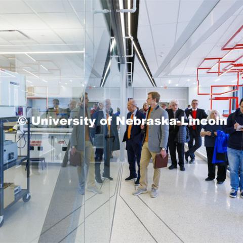 Board of Regents look through the glass walls of one of the labs in the newly built Engineering Research Center during their tour of UNL. College of Engineering. April 7, 2022. Photo by Craig Chandler / University Communication.