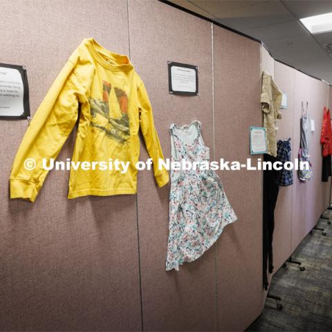 The “What Were You Wearing?” survivor art installation in the new CARE space within Neihardt features a display of recreations of outfits worn by those who were sexually assaulted with accompanying stories from the survivors. It was shown in Neihardt Center as a way for Huskers to see the space CARE will move into during the summer. April 12, 2022. Photo by Craig Chandler / University Communication.