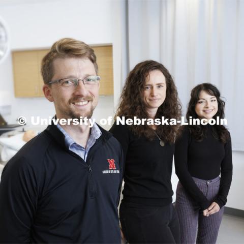 (From left) Husker researchers Arthur “Trey” Andrews, Tierney Lorenz and Sara Reyes are part of a team investigating how interpersonal discrimination affects Latinos, creating wear and tear on the body that may ultimately lead to chronic health conditions like cardiovascular disease. They are photographed in the teaching lab of the Lincoln division of the University of Nebraska Medical Center's nursing program. April 20, 2022. Photo by Craig Chandler / University Communication.