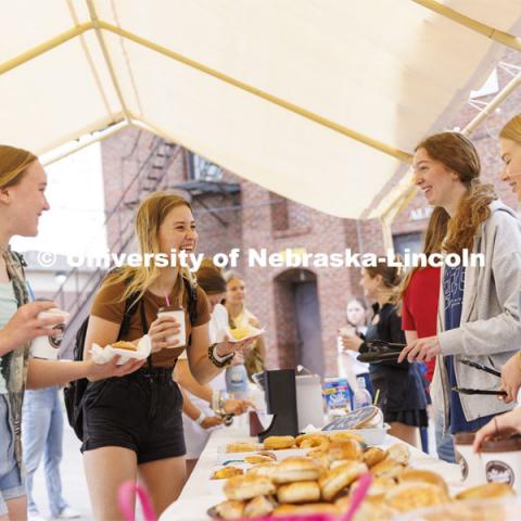 Cup of Joe with Chi Os served up donuts, bagels and coffee to students Friday morning. April 22, 2022. Photo by Craig Chandler / University Communication.