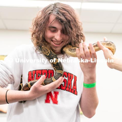 Students pet animals during the End of Year Bash inside the East Campus Union on Saturday, April 30, 2022, in Lincoln, Nebraska.  Photo by Jordan Opp for University Communication
