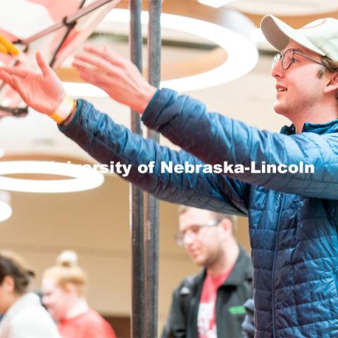 Students play carnival games during the End of Year Bash inside the East Campus Union on Saturday, April 30, 2022, in Lincoln, Nebraska.  Photo by Jordan Opp for University Communication
