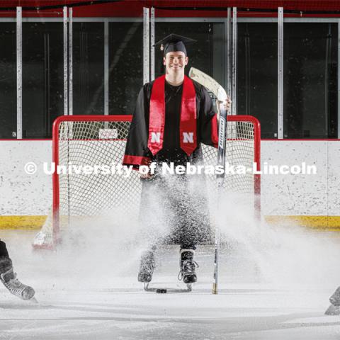 Alex Cathcart came to Nebraska to pursue a hockey career, but he scored with a mathematics degree from the University of Nebraska–Lincoln. He is assisted in the photo by John Rupert, a sophomore from Minnesota. May 2, 2022. Photo by Craig Chandler / University Communication.