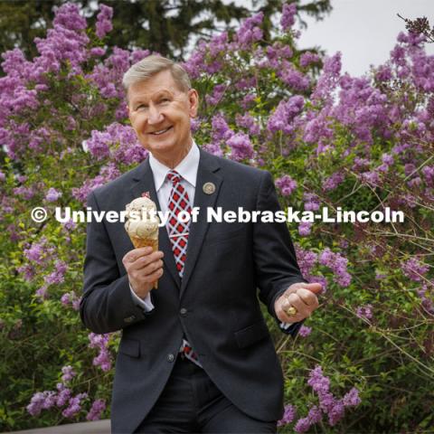 President Ted Carter of the University of Nebraska enjoys an ice cream cone of Carter’s Coffee Crunch, named for the new president. May 4, 2022.  Photo by Craig Chandler / University Communication. 