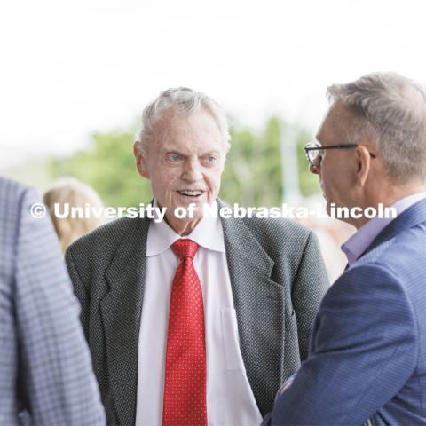 NU President Ted Carter, Former Husker football coach Tom Osborne, and UNL Chancellor Ronnie Green talk following the ribbon cutting. Ribbon cutting for the new Scarlet Hotel in Nebraska Innovation Campus. March 6, 2021. Photo by Craig Chandler / University Communication.