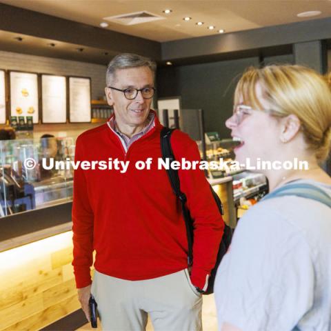 UNL Chancellor Ronnie Green chats with graduating senior Elinor Stanley as they wait for their coffee Monday morning. This week is Finals Fuel week. The Chancellor is providing free drip coffee from Starbucks May 9-13 as students take on finals week. A free cup of coffee will be available for students at Union Welcome Desk in the Nebraska Union and Starbucks in the Nebraska East Union. May 9, 2021. Photo by Craig Chandler / University Communication.