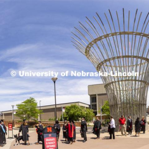 Grads line up outside Pinnacle Bank Arena before commencement. Graduate commencement in Pinnacle Bank Arena. May 13, 2022. Photo by Craig Chandler / University Communication.