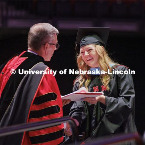 Chancellor Ronnie Green hands out diplomas to grads. Graduate commencement in Pinnacle Bank Arena. May 13, 2022. Photo by Craig Chandler / University Communication.