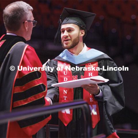 Kobe Webster receives his masters degree. The Huskers men’s basketball player received his masters degree Friday. The Husker athletes are wearing a custom stole during the commencements. Graduate commencement in Pinnacle Bank Arena. May 13, 2022. Photo by Craig Chandler / University Communication.