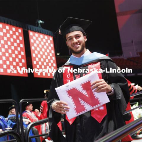 Kobe Webster receives his masters degree. The Huskers men’s basketball player received his masters degree Friday. The Husker athletes are wearing a custom stole during the commencements. Graduate commencement in Pinnacle Bank Arena. May 13, 2022. Photo by Craig Chandler / University Communication.