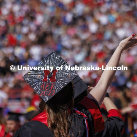 Ashton Koch’s bedazzled mortarboard sparkles in the morning sun. UNL undergraduate commencement in Memorial Stadium. May 14, 2022. Photo by Craig Chandler / University Communication.