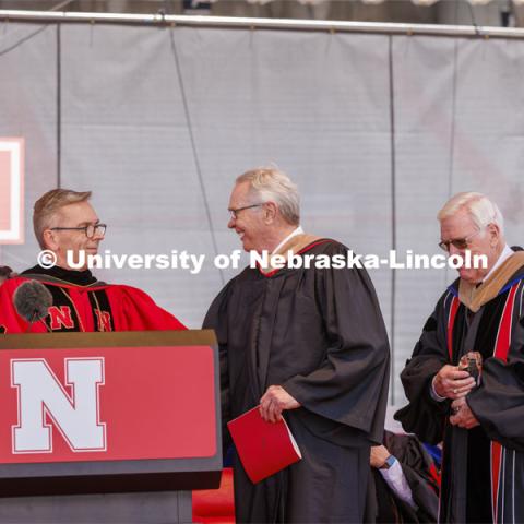 Terry Fairfield, center, along with UNL Chancellor Ronnie Green, left, and NU Regent Bob Phares. Fairfield was honored with the Nebraska Builder Award. UNL undergraduate commencement in Memorial Stadium. May 14, 2022. Photo by Craig Chandler / University Communication.
