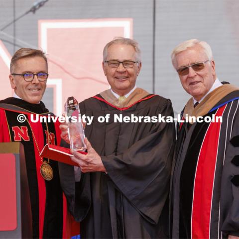 Terry Fairfield, center, along with UNL Chancellor Ronnie Green, left, and NU Regent Bob Phares. Fairfield was honored with the Nebraska Builder Award. UNL undergraduate commencement in Memorial Stadium. May 14, 2022. Photo by Craig Chandler / University Communication.