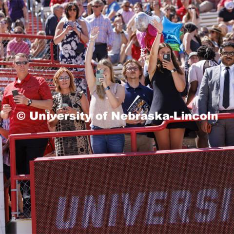 Friends and family crowd the rail to photograph their graduates. UNL undergraduate commencement in Memorial Stadium. May 14, 2022. Photo by Craig Chandler / University Communication.
