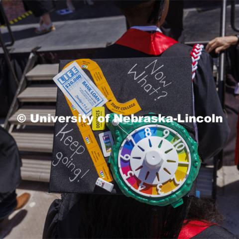 Decorated mortarboards at UNL undergraduate commencement in Memorial Stadium. May 14, 2022. Photo by Craig Chandler / University Communication.