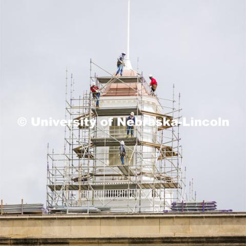 Scaffolding begins to surround the Love Library cupola as part of the renovation process. June 6, 2022. Photo by Craig Chandler / University Communication.