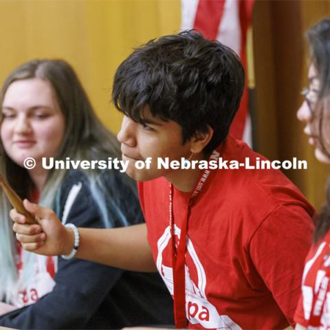 Melaki George of Winnebago High School tries to gavel the courtroom back to order as he presides with two other judges over the trial of Goldilocks vs the Three Bears. NCPA junior and senior high school students participate in a mock trial at Nebraska Law. June 9, 2022. Photo by Craig Chandler / University Communication.