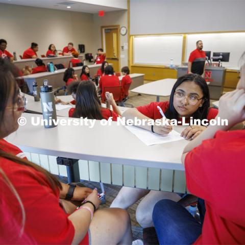 Ana Cortez Martir, junior from Omaha South High school, works with her team as they develop a business pitch during their session at the College of Business. NCPA, a program for academically talented, first-generation, income eligible students to help prepare them for college and their future careers. June 9, 2022. Photo by Craig Chandler / University Communication.