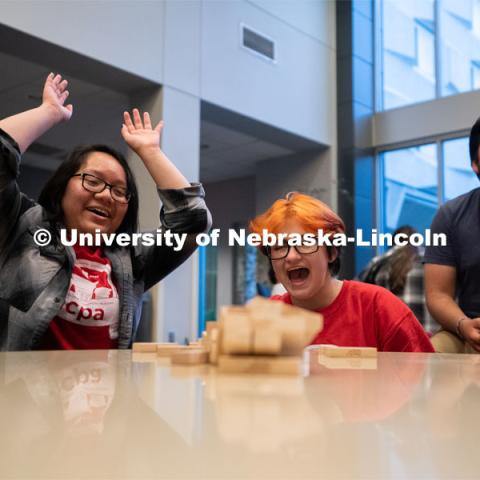 Attendees of the Nebraska College Preparatory Academy Science Camp react after a Jenga tower falls inside of Abel Hall during the Nebraska College Preparatory Academy’s Science Camp. NCPA, a program for academically talented, first-generation, income eligible students to help prepare them for college and their future careers. June 9, 2022. Photo by Jordan Opp for University Communication.