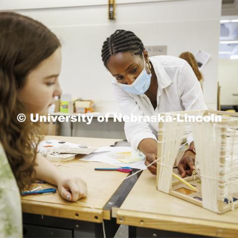 High school students in the College of Architecture high school camp work on their projects with Aziza Cyamani, Assistant Professor of Architecture. June 16, 2022. Photo by Craig Chandler / University Communication.