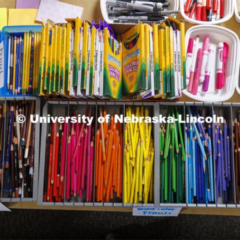 Bins of colored pencils and markers at an art station. Guy Trainin’s project is Art TEAMS: Nurturing Educators Who Integrate Art, Core Subjects and Culturally Responsive Teaching to Support Students in Becoming Makers of Change. June 17, 2022. Photo by Craig Chandler / University Communication.