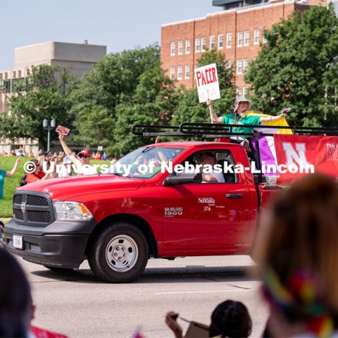 University of Nebraska representatives wave to the crowd during the Star City Pride parade. June 18, 2022. Photo by Jordan Opp for University Communication.