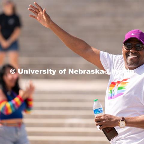 University of Nebraska representatives wave to the crowd during the Star City Pride parade. June 18, 2022. Photo by Jordan Opp for University Communication.