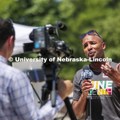 Marco Barker, Vice Chancellor for Diversity and Inclusion, speaks with local news affiliate KLKN-TV from the plaza of the Nebraska Union. Juneteenth, the federal holiday that commemorates the emancipation of enslaved Black Americans, is celebrated in an event starting at noon on the Nebraska Union Plaza. June 20, 2022. Photo by Craig Chandler / University Communication.