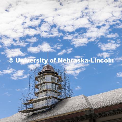Scaffolding work begins to surround the Love Library cupola as part of the renovation process. Love Library cupola renovation. June 22, 2022. Photo by Craig Chandler / University Communication.