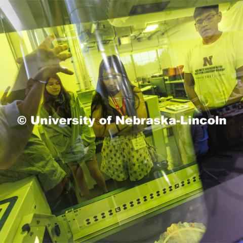 Max Wheeler with Nebraska Innovation Studio explains how the laser cutter works. 2022 MATC/NCIA Sovereign Native Youth STEM Leadership Academy. June 30, 2022. Photo by Craig Chandler / University Communication.