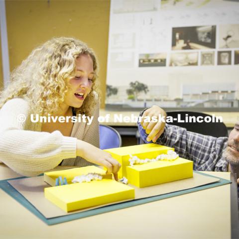 Lloyd “Bud” Shenefelt, Assistant Professor of Architecture, critiques a design by second year student Lauren Christopher of Bloomington, Illinois, in the d.Make summer class.  The class is re-imagining the Haymarket gallery alley.  July 1, 2022. Photo by Craig Chandler / University Communication.  