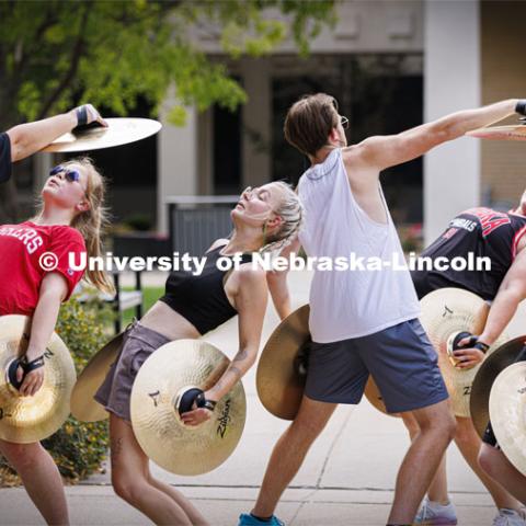 The Cornhusker Marching Band percussion groups kick off the school year at Cornhusker Marching Band camp. Cymbals doing their performance art with a shout out to the Matrix. They call this “Blade Time”. August 11, 2022. Photo by Craig Chandler / University Communication.