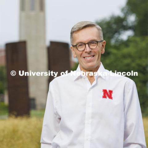 Chancellor Ronnie Green with the Mueller Bell Tower and Greenpoint sculpture in the background. August 16, 2022. Photo by Craig Chandler / University Communication.