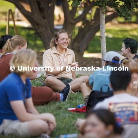 Sam Pharris, a freshman from Aberdeen, South Dakota, talks with new friends at the Hixon-Lied College of Fine and Performing Arts for their College Welcome for new and returning students. Big Red Welcome - College Welcome Programs. August 18, 2022. Photo by Craig Chandler / University Communication.