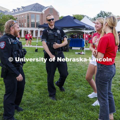 UNL Police Department officers talk with students at the Chancellor’s BBQ to welcome the class of 2026 in the greenspace by the Nebraska Union. August 19, 2022. Photo by Craig Chandler / University Communication.
