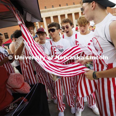 Students on Smith Residence Hall’s tenth floor admire the striped overalls they all wore to the Street Fest. Sunday, the Street Fest filled the parking lot by East Stadium with hundreds of booths hosted by local businesses, nonprofit organizations, UNL departments and plenty of music, free food, giveaways and prizes. August 21, 2022. Photo by Craig Chandler / University Communication.