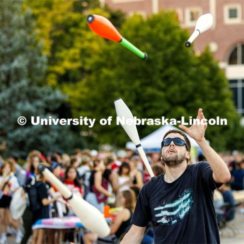 Steven Strausberg with the Lincoln City Juggling Club puts on a demonstration Sunday. Sunday, the Street Fest filled the parking lot by East Stadium with hundreds of booths hosted by local businesses, nonprofit organizations, UNL departments and plenty of music, free food, giveaways and prizes. August 21, 2022. Photo by Craig Chandler / University Communication.