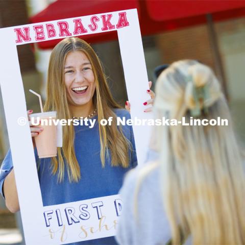 Jada Scribner, a sophomore from Woodbury, Minnesota, has a great smile, a smoothie and a first day of school photo. Husker Catholic took photos in front of the Nebraska Union of anyone who wanted a first day of school photo. First day of classes. August 22, 2022. Photo by Craig Chandler / University Communication.