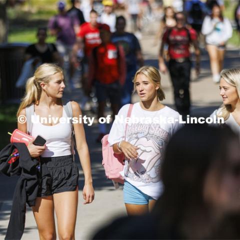 Claire Thornton, Emma Liberta and Maddy Wells walk through the plaza as the three freshmen return from a morning class. First day of classes. August 22, 2022. Photo by Craig Chandler / University Communication.