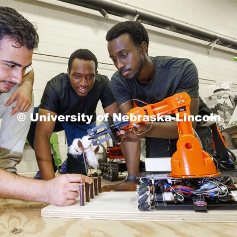 Hessan Sedaghat, Salem Nyacyesa and Herve Mwunguzi demonstrate their national champion cotton picking robot. Santosh Pitla in his robotics lab on East Campus. September 2, 2022. Photo by Craig Chandler / University Communication.