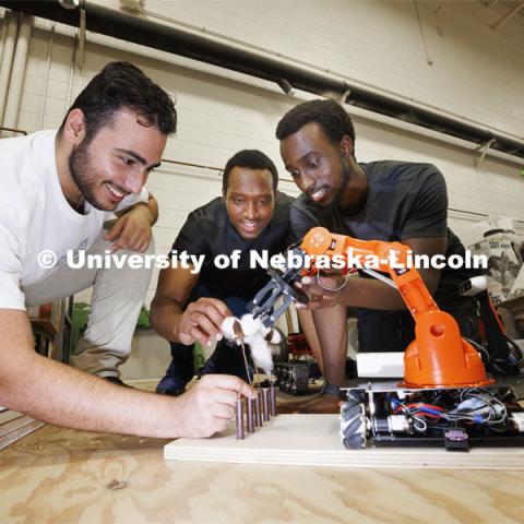 Hessan Sedaghat, Salem Nyacyesa and Herve Mwunguzi demonstrate their national champion cotton picking robot. Santosh Pitla in his robotics lab on East Campus. September 2, 2022. Photo by Craig Chandler / University Communication.