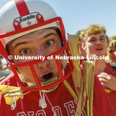 Denis McGinty, a sophomore from Chicago, suited up with a helmet and cornstalk for the game. Student Tailgate and Unity Walk in the Union green space before the game. NU vs. North Dakota. September 3, 2022. Photo by Craig Chandler / University Communication.