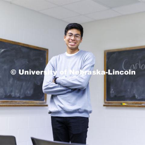 Carlos Ortega, junior in secondary education, and NSE student orientation leader, smiles for a photo in a classroom on campus. September 7, 2022.  Photo by Craig Chandler / University Communication.